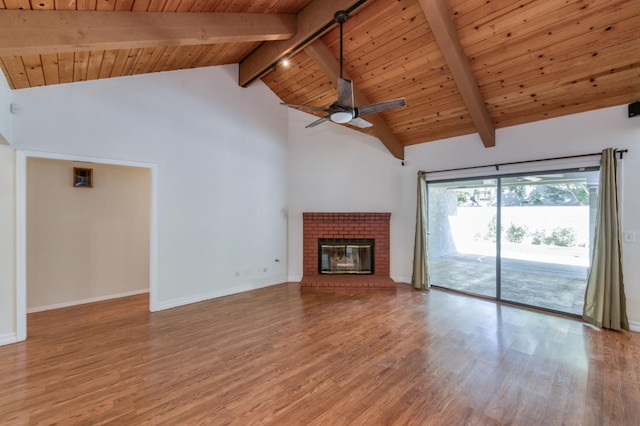 689 E Pintail Cir, Fresno, CA 93730 - unfurnished living room with a wood ceiling with exposed beams, light wood-type flooring, high vaulted ceiling, a fireplace, and a ceiling fan