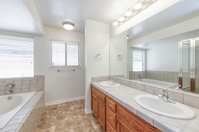 689 E Pintail Cir, Fresno, CA 93730 - bathroom with double vanity, a garden tub, and a shower stall