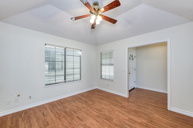 689 E Pintail Cir, Fresno, CA 93730 - unfurnished room with vaulted ceiling, light wood-style floors, and a ceiling fan