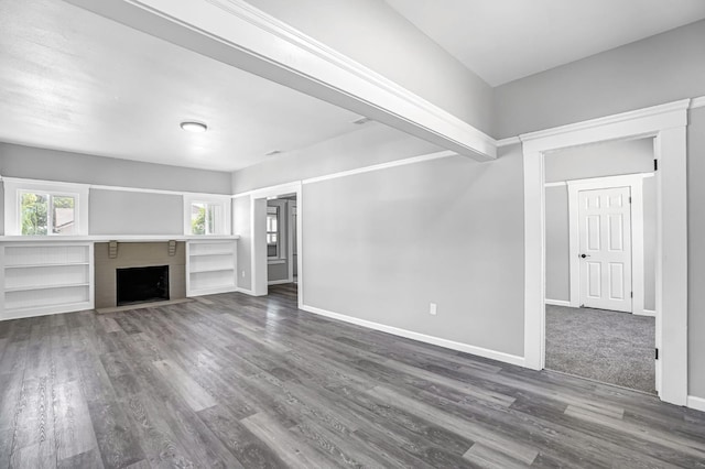 1303 N Calaveras St, Fresno, CA 93728 - unfurnished living room featuring dark wood finished floors and a fireplace with flush hearth