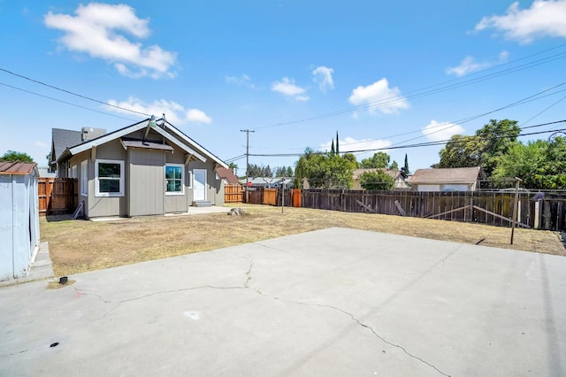 1303 N Calaveras St, Fresno, CA 93728 - back of property with a patio area and a fenced backyard