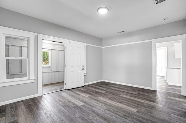 1303 N Calaveras St, Fresno, CA 93728 - empty room with dark wood-style floors and a smoke detector