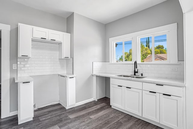 1303 N Calaveras St, Fresno, CA 93728 - kitchen featuring tasteful backsplash, white cabinets, dark wood-style flooring, and light stone countertops