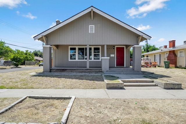 1303 N Calaveras St, Fresno, CA 93728 - bungalow-style home featuring covered porch and a chimney