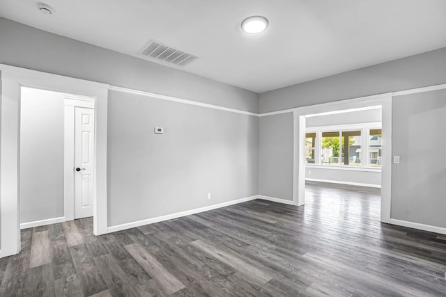 1303 N Calaveras St, Fresno, CA 93728 - unfurnished room featuring a smoke detector and dark wood-style flooring