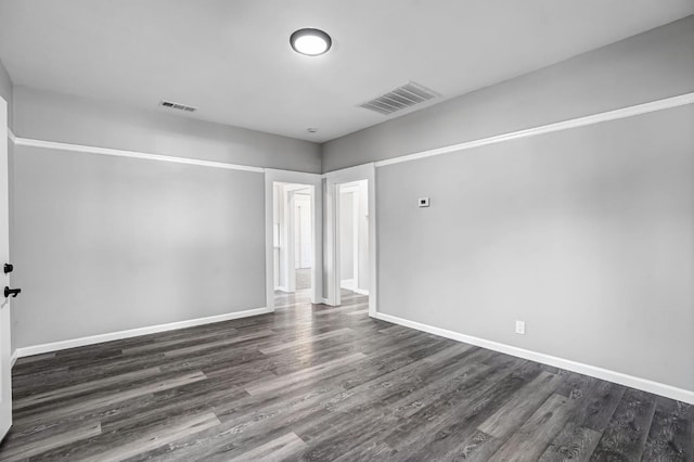 1303 N Calaveras St, Fresno, CA 93728 - empty room featuring dark wood-type flooring and baseboards