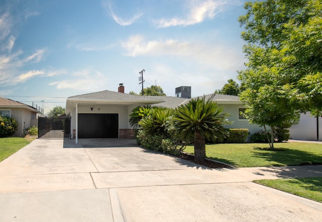 4342 E Buckingham Way, Fresno, CA 93726 - view of front of home with an attached garage, concrete driveway, a front lawn, a gate, and a chimney