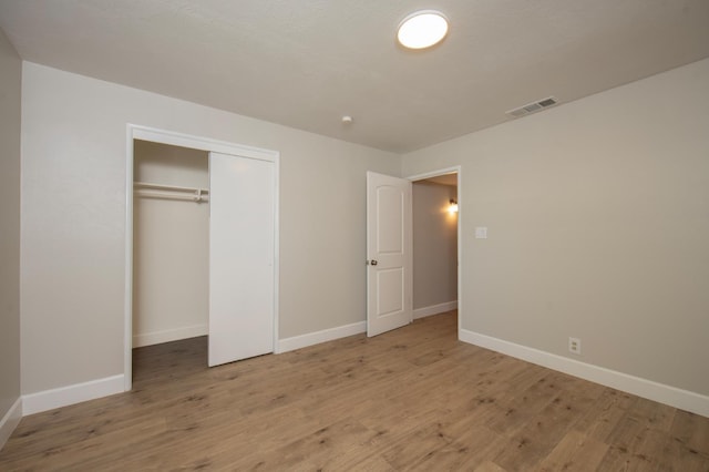 4342 E Buckingham Way, Fresno, CA 93726 - unfurnished bedroom with light wood-style flooring and a closet