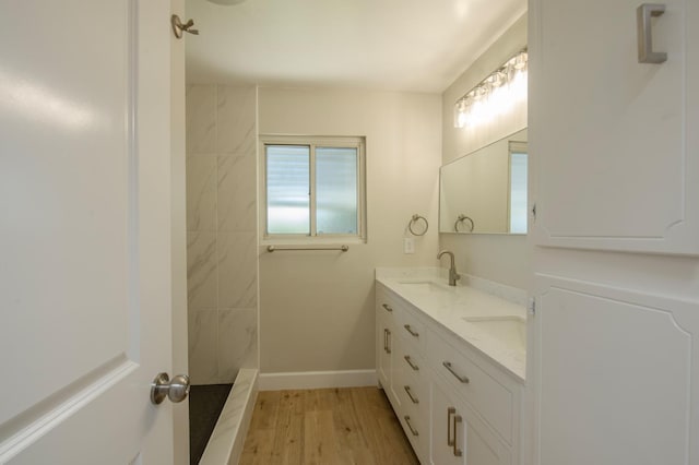 4342 E Buckingham Way, Fresno, CA 93726 - full bathroom featuring double vanity, wood finished floors, and a shower
