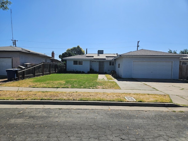 432 Brimmer Rd, Merced, CA 95341 - single story home with an attached garage, roof mounted solar panels, concrete driveway, and stucco siding