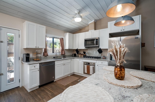 5072 N Wishon Ave Unit C, Fresno, CA 93704 - kitchen featuring appliances with stainless steel finishes, lofted ceiling, white cabinets, dark wood finished floors, and a ceiling fan