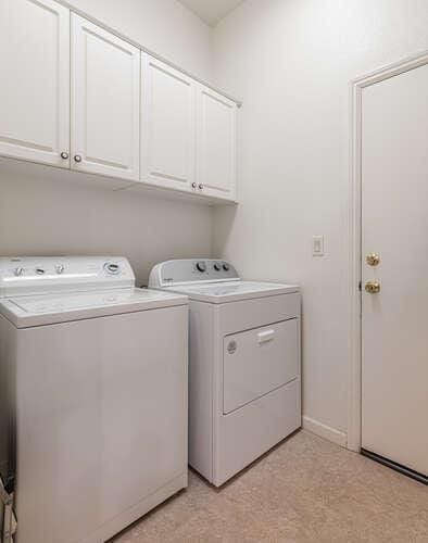 5214 N Via Trevi, Fresno, CA 93711 - washroom with independent washer and dryer, cabinet space, and light floors