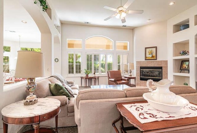 5214 N Via Trevi, Fresno, CA 93711 - living area with plenty of natural light, built in features, a ceiling fan, a fireplace, and recessed lighting