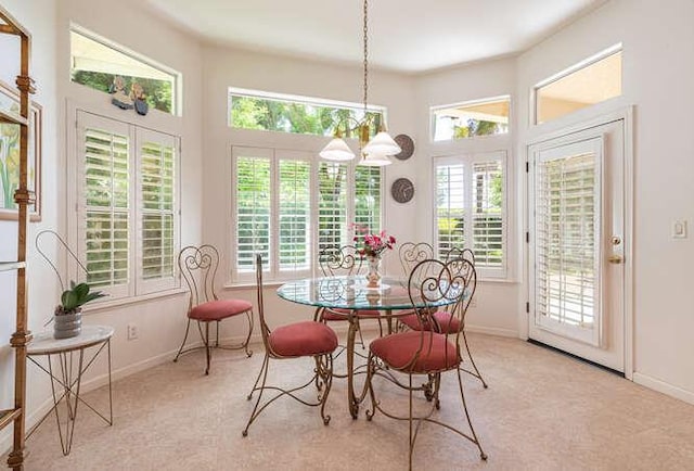 5214 N Via Trevi, Fresno, CA 93711 - carpeted dining area featuring baseboards and a chandelier
