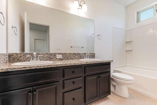 2166 Junipero Ave, Clovis, CA 93619 - full bathroom with double vanity, tile patterned floors, and washtub / shower combination
