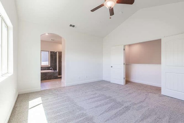 2166 Junipero Ave, Clovis, CA 93619 - unfurnished bedroom with arched walkways, carpet flooring, high vaulted ceiling, a closet, and a ceiling fan