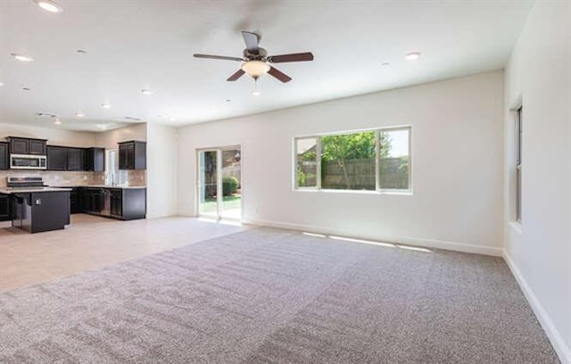 2166 Junipero Ave, Clovis, CA 93619 - unfurnished living room with light carpet, ceiling fan, and recessed lighting