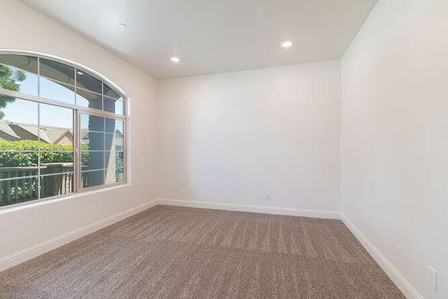 2166 Junipero Ave, Clovis, CA 93619 - carpeted empty room with baseboards and recessed lighting