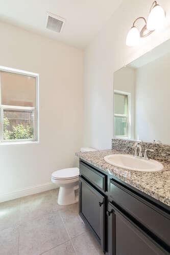 2166 Junipero Ave, Clovis, CA 93619 - bathroom featuring vanity and tile patterned flooring