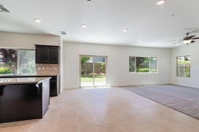 2166 Junipero Ave, Clovis, CA 93619 - kitchen with open floor plan, healthy amount of natural light, ceiling fan, recessed lighting, and tasteful backsplash