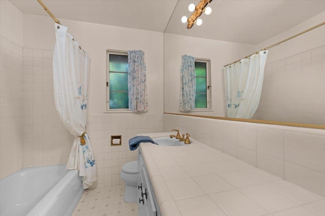 5481 E Geary St, Fresno, CA 93727 - full bathroom with vanity, shower / bath combination with curtain, and tile walls
