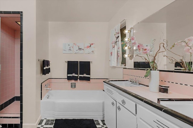 5481 E Geary St, Fresno, CA 93727 - bathroom featuring a bath, double vanity, tile patterned flooring, and a tile shower
