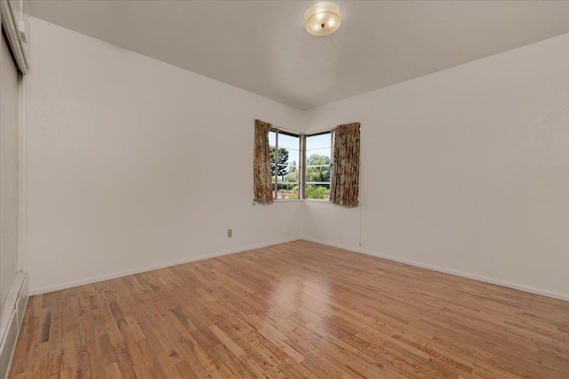 5481 E Geary St, Fresno, CA 93727 - unfurnished room with light wood-style flooring and baseboards