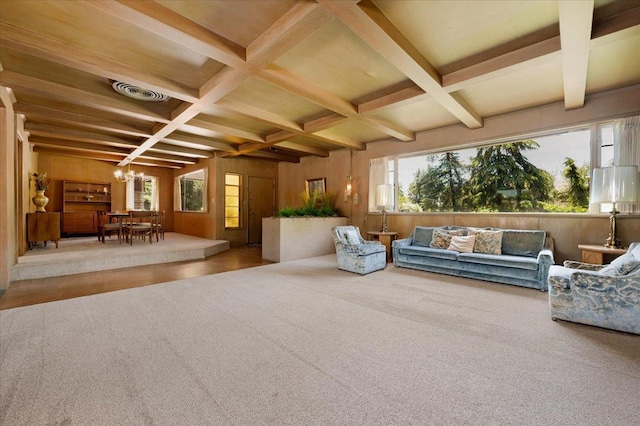 5481 E Geary St, Fresno, CA 93727 - carpeted living area with a chandelier, coffered ceiling, beam ceiling, and wooden walls