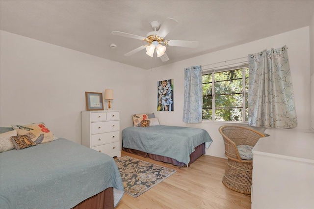 5481 E Geary St, Fresno, CA 93727 - bedroom featuring light wood finished floors and ceiling fan