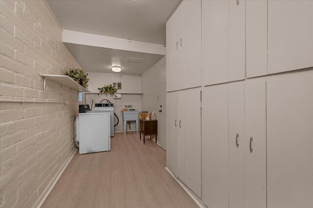 5481 E Geary St, Fresno, CA 93727 - laundry room with washer / dryer and light wood-style floors