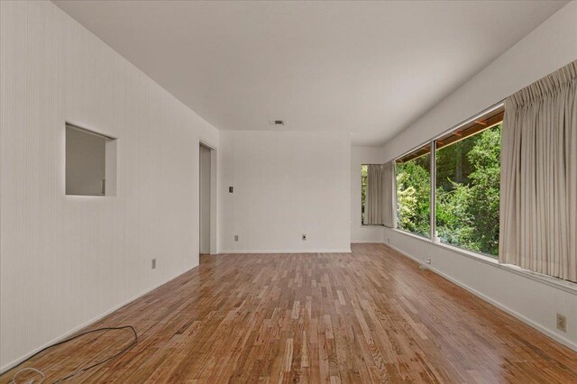 5481 E Geary St, Fresno, CA 93727 - empty room featuring wood finished floors and baseboards