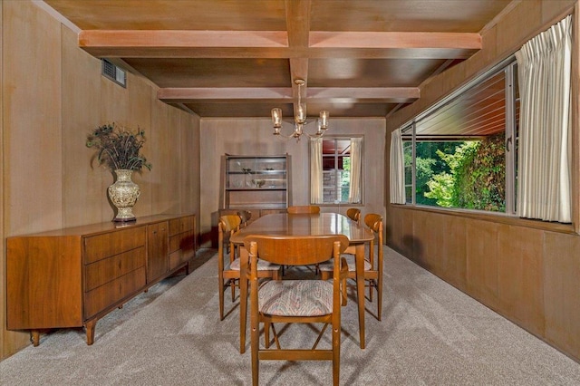 5481 E Geary St, Fresno, CA 93727 - dining space featuring light carpet, a chandelier, beam ceiling, wooden walls, and coffered ceiling