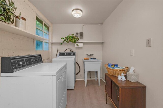5481 E Geary St, Fresno, CA 93727 - laundry room featuring light wood-style floors and washing machine and dryer