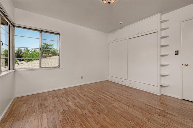 5481 E Geary St, Fresno, CA 93727 - unfurnished bedroom with light wood-style flooring and a closet