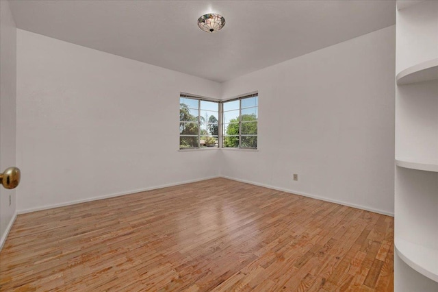 5481 E Geary St, Fresno, CA 93727 - spare room featuring light wood finished floors and baseboards