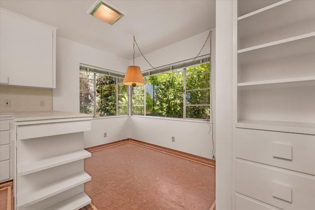 5481 E Geary St, Fresno, CA 93727 - unfurnished dining area with baseboards