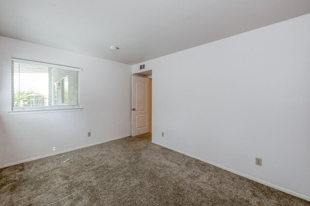 9340 N Jackson Ave, Fresno, CA 93720 - empty room featuring carpet flooring and baseboards
