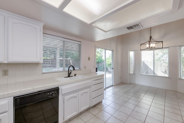 9340 N Jackson Ave, Fresno, CA 93720 - kitchen with black dishwasher, tile countertops, white cabinetry, a chandelier, and light tile patterned floors