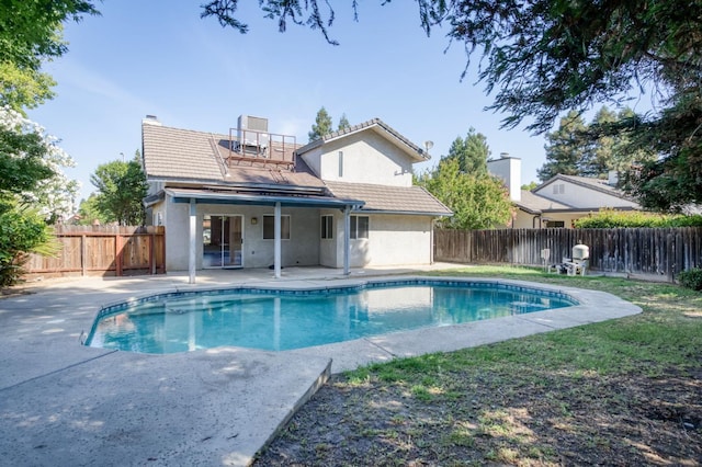 9340 N Jackson Ave, Fresno, CA 93720 - back of property with a patio area, stucco siding, a fenced backyard, and a tiled roof