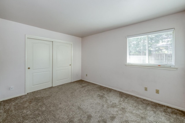 9340 N Jackson Ave, Fresno, CA 93720 - unfurnished bedroom with carpet floors and a closet