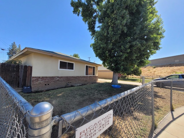 view of front of home with brick siding and stucco siding