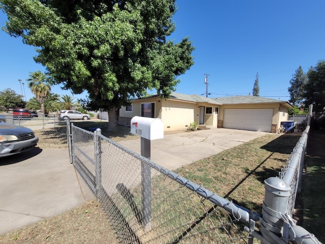 ranch-style home with an attached garage, driveway, and stucco siding