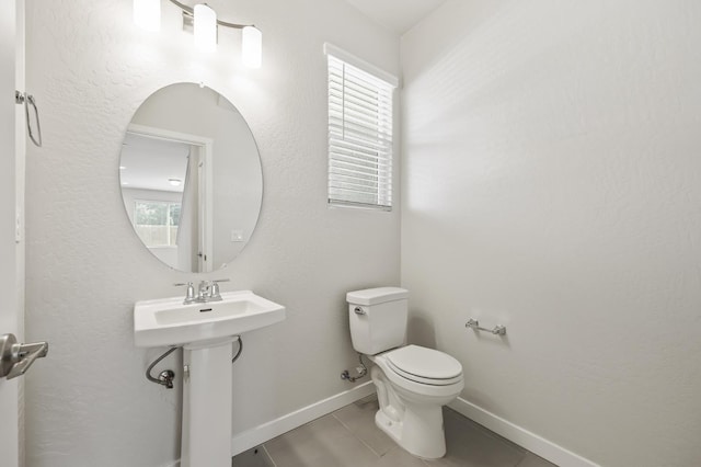 834 Amanecer Ave, Clovis, CA 93619 - half bath featuring toilet and tile patterned flooring