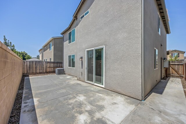 834 Amanecer Ave, Clovis, CA 93619 - back of house with stucco siding, a patio, and a fenced backyard