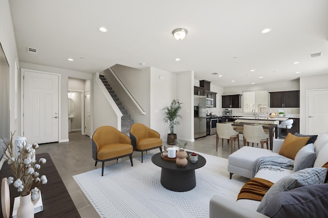 834 Amanecer Ave, Clovis, CA 93619 - living room with recessed lighting, stairs, and light tile patterned flooring