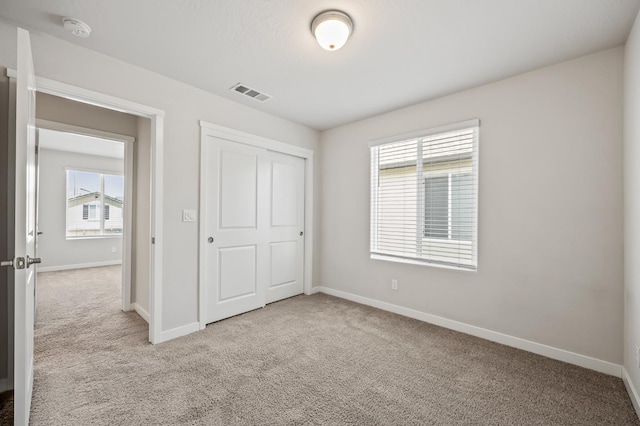 834 Amanecer Ave, Clovis, CA 93619 - unfurnished bedroom featuring light carpet and a closet