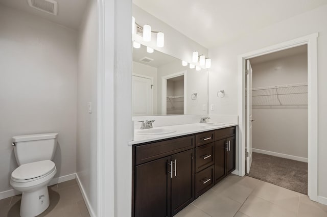 834 Amanecer Ave, Clovis, CA 93619 - bathroom featuring double vanity, a spacious closet, and tile patterned flooring