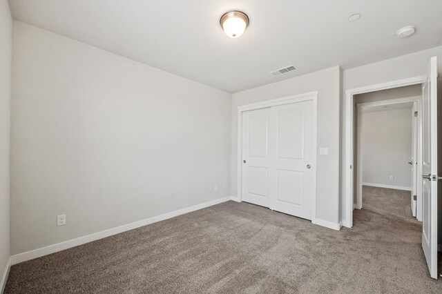 834 Amanecer Ave, Clovis, CA 93619 - unfurnished bedroom featuring carpet and a closet