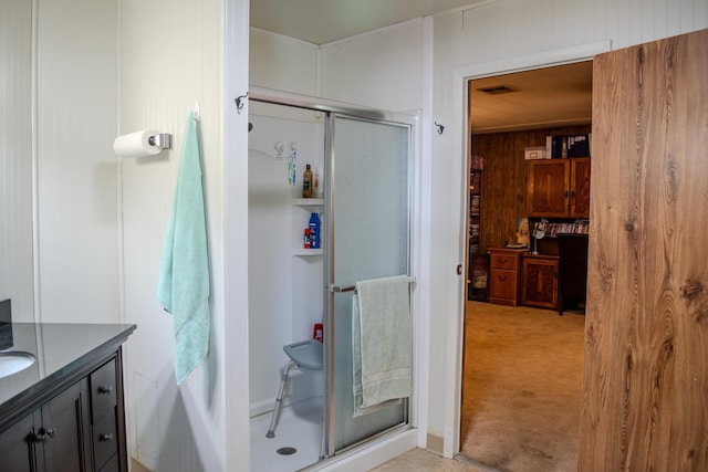 371 Bethel Ave Unit 62, Sanger, CA 93657 - full bathroom featuring a shower stall, vanity, and wood walls