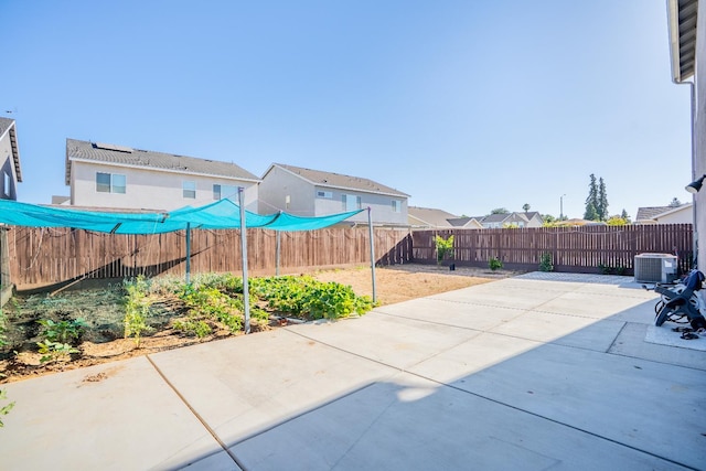 6569 E Lyell Ave, Fresno, CA 93727 - fenced backyard featuring a patio area and a residential view